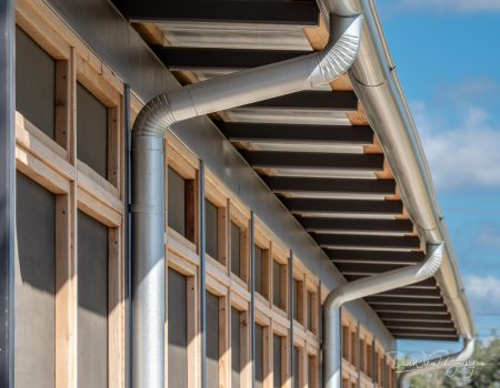 Looking along the side of The Switch barbecue restaurant in Belterra Village, Dripping Springs, Texas.